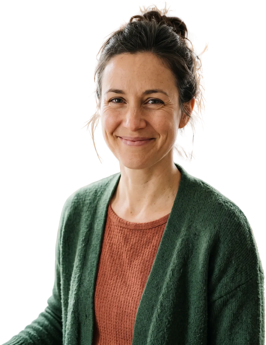 Sarah, smiling, in a green cardigan